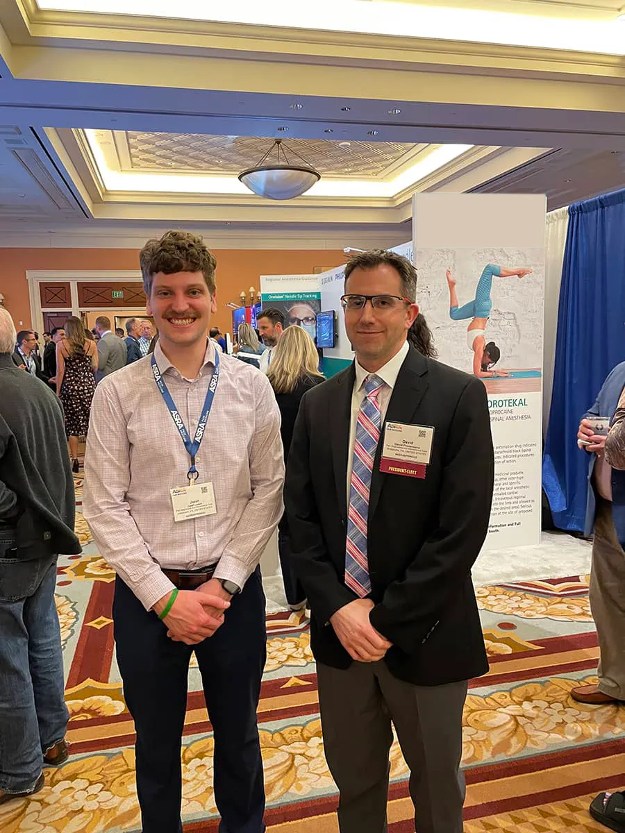 Dr. David Provenzano with a research intern at a conference