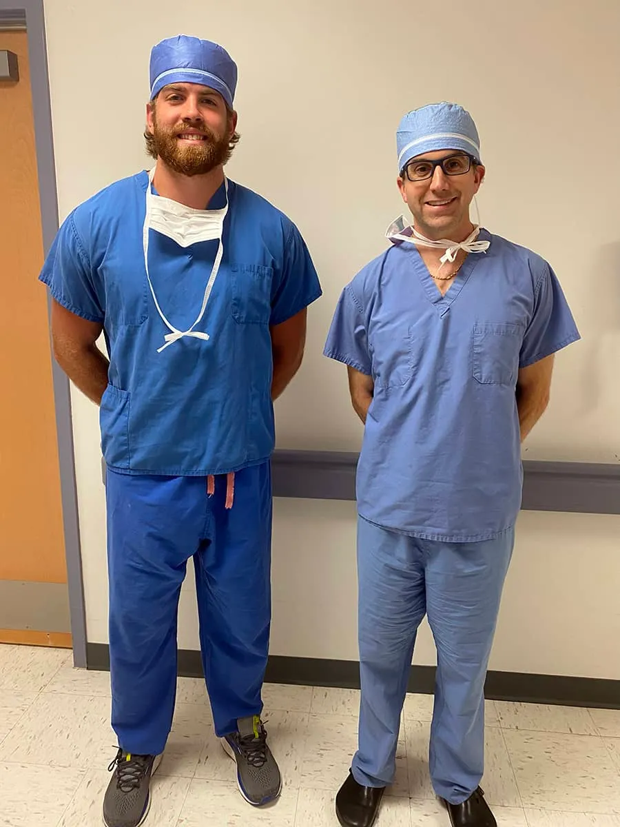 Dr. David Provenzano and a research intern in surgical scrubs