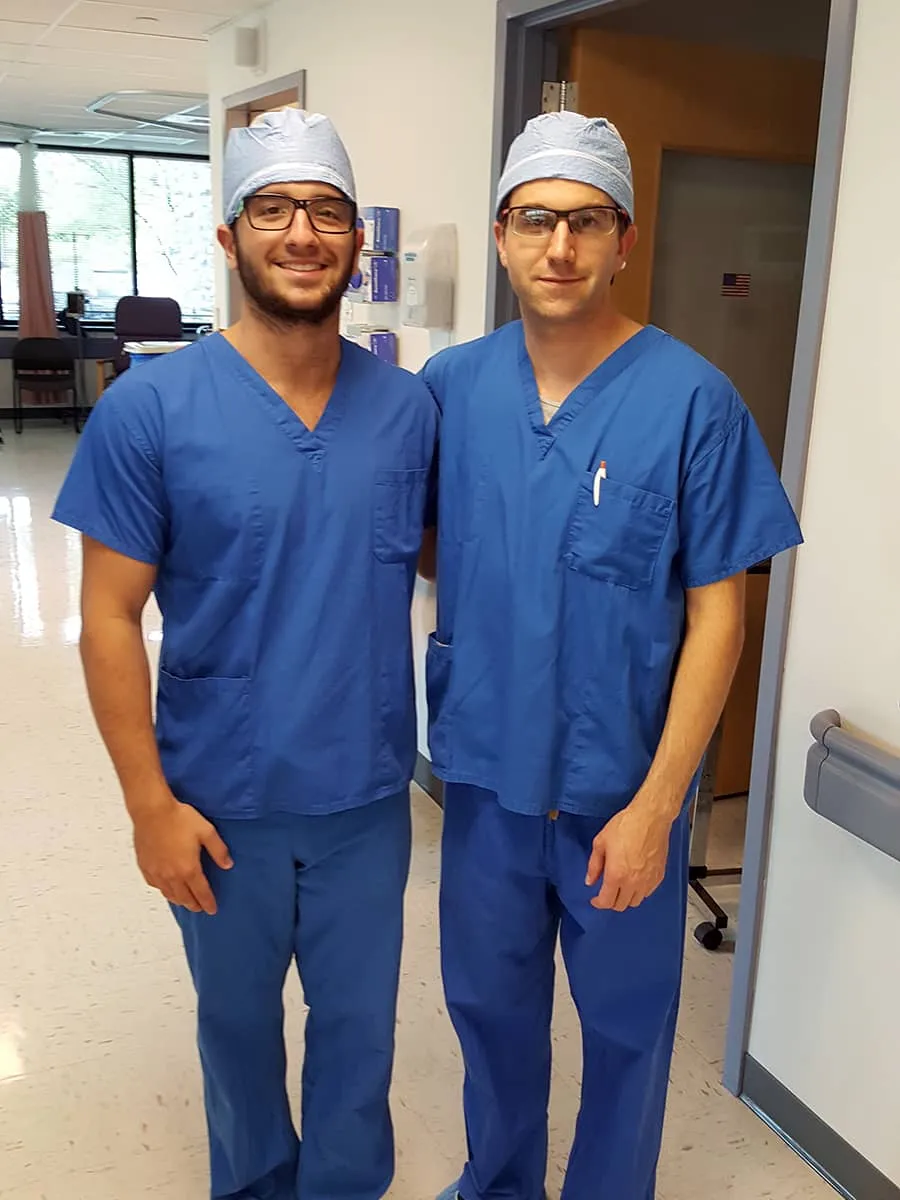 Dr. David Provenzano and a research intern in surgical scrubs