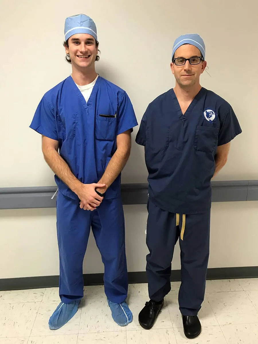 Dr. David Provenzano and a research intern in surgical scrubs
