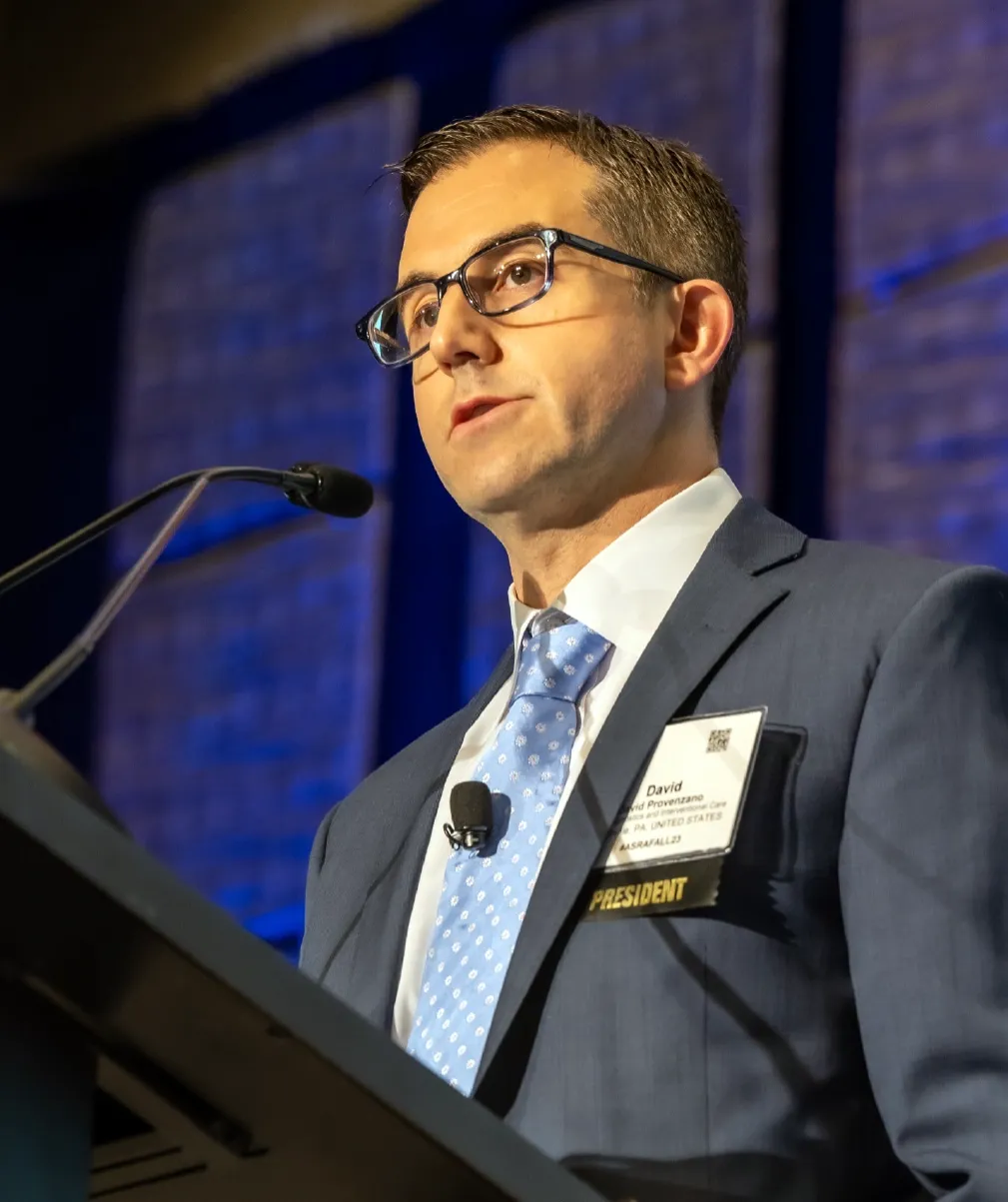 Dr. David Provenzano speaking at a podium