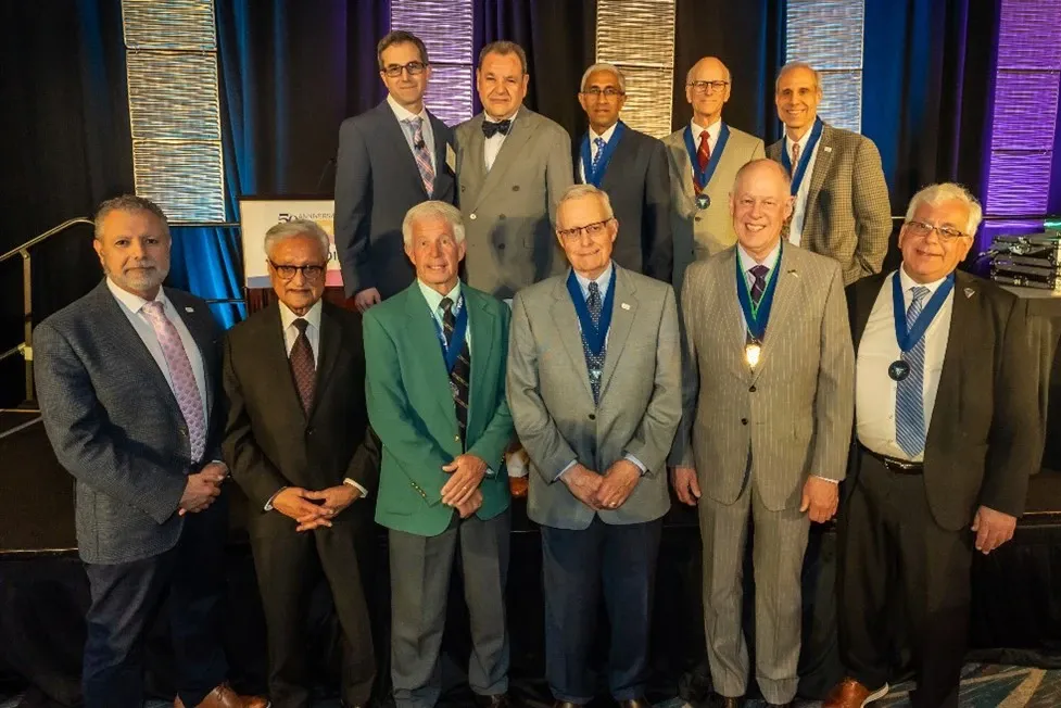 Dr. David Provenzano with a group of colleagues at a conference, several wearing medals