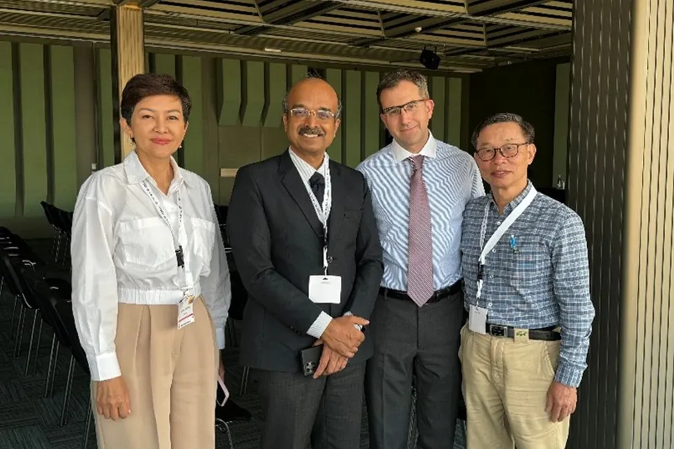 Dr. David Provenzano with three colleagues at a conference