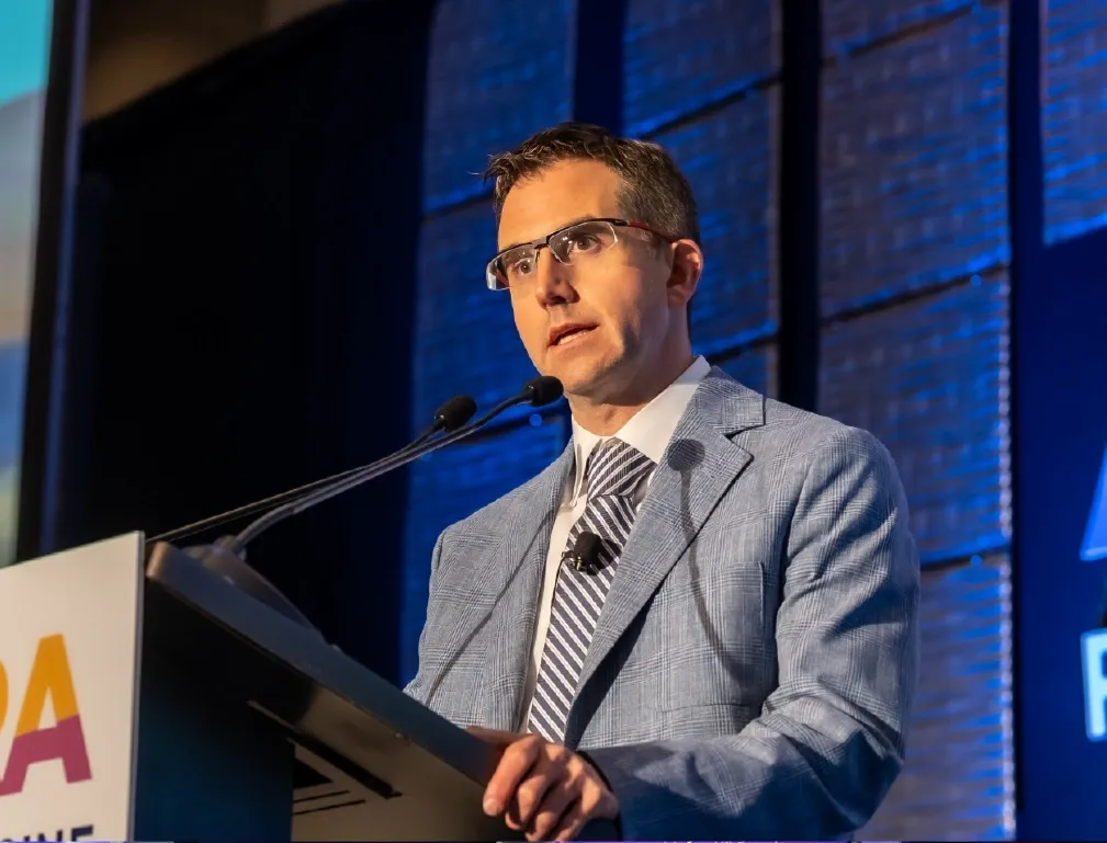 Dr. David Provenzano speaking at a podium